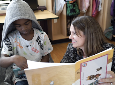 Student and staff reading